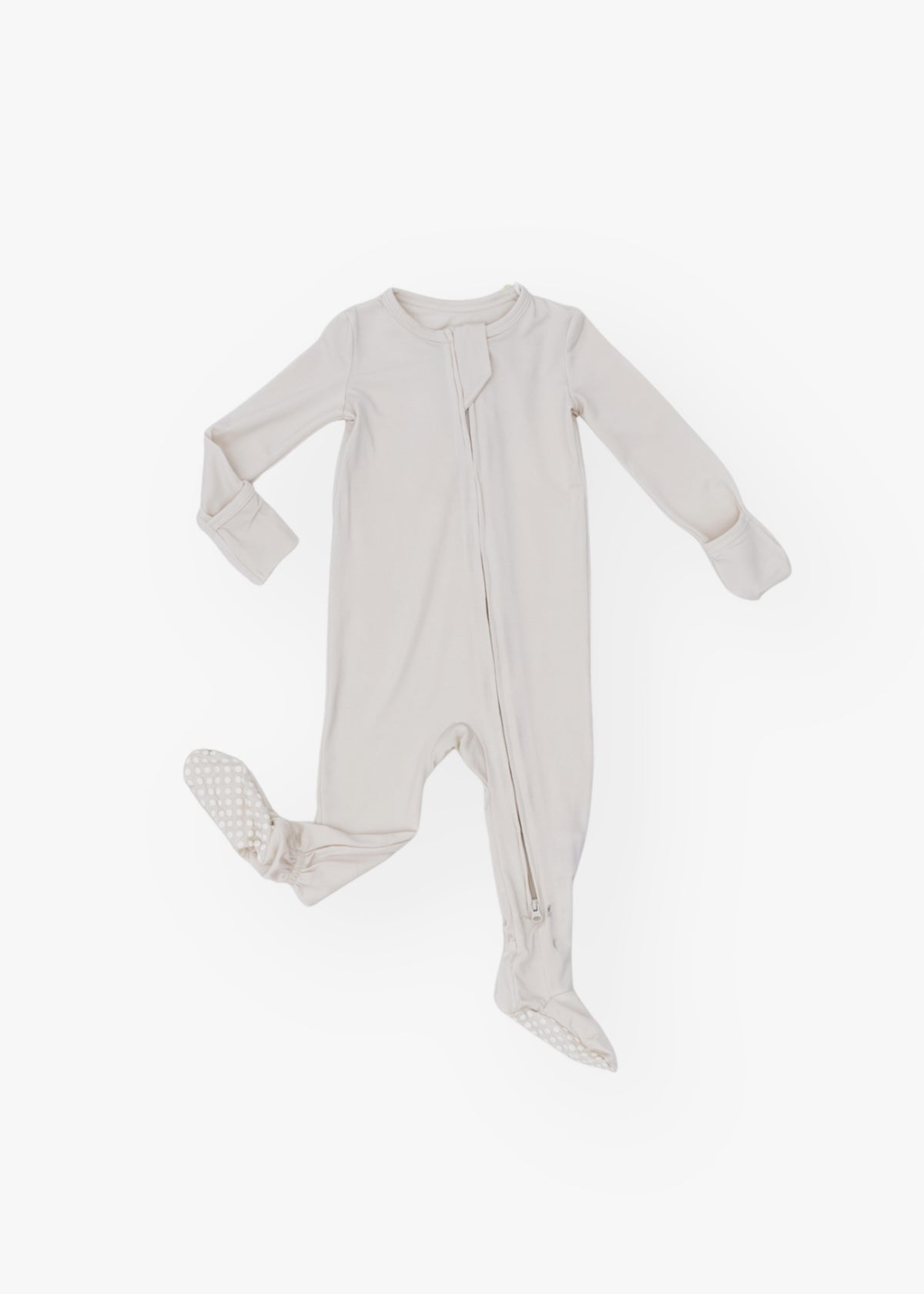 Milana Label kids zip footie sleeper in Birch, a warm neutral tone, with grip dots on the feet.