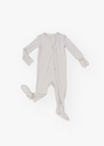 Milana Label kids zip footie sleeper in Birch, a warm neutral tone, with grip dots on the feet.