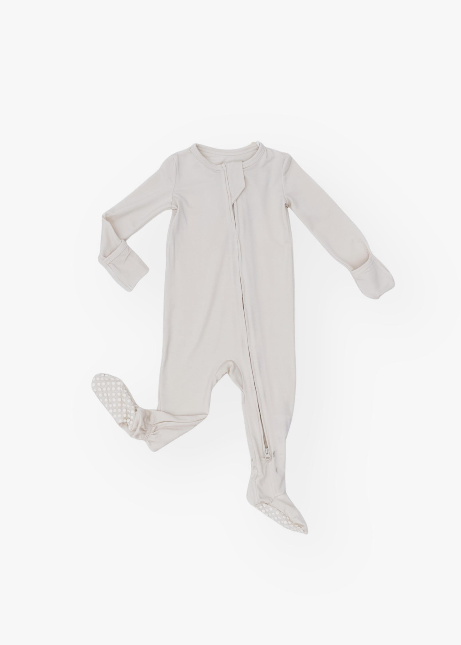 Milana Label kids zip footie sleeper in Birch, a warm neutral tone, with grip dots on the feet.