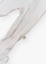 Milana Label kids zip footie sleeper in Birch, a warm neutral tone, with grip dots on the feet.