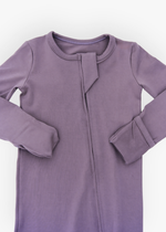 Milana Label kids zip footie sleeper in Wild Mulberry, a muted dusty purple tone, with grip dots on the feet.