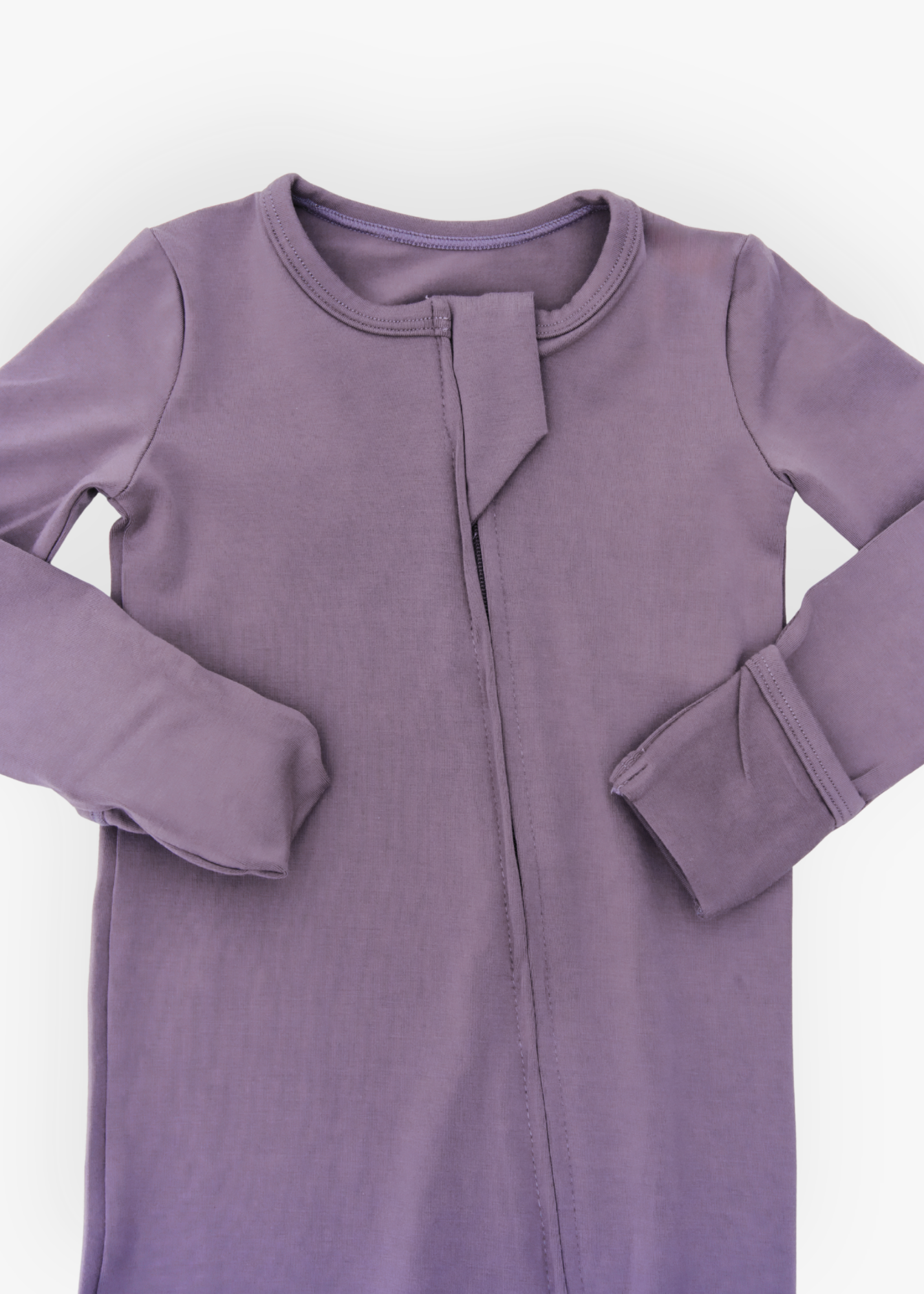 Milana Label kids zip footie sleeper in Wild Mulberry, a muted dusty purple tone, with grip dots on the feet.