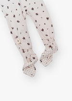 Milana Label kids zip footie sleeper in Birch Floral, a warm neutral fabric with a scattered dark floral print, with grip dots on the feet.