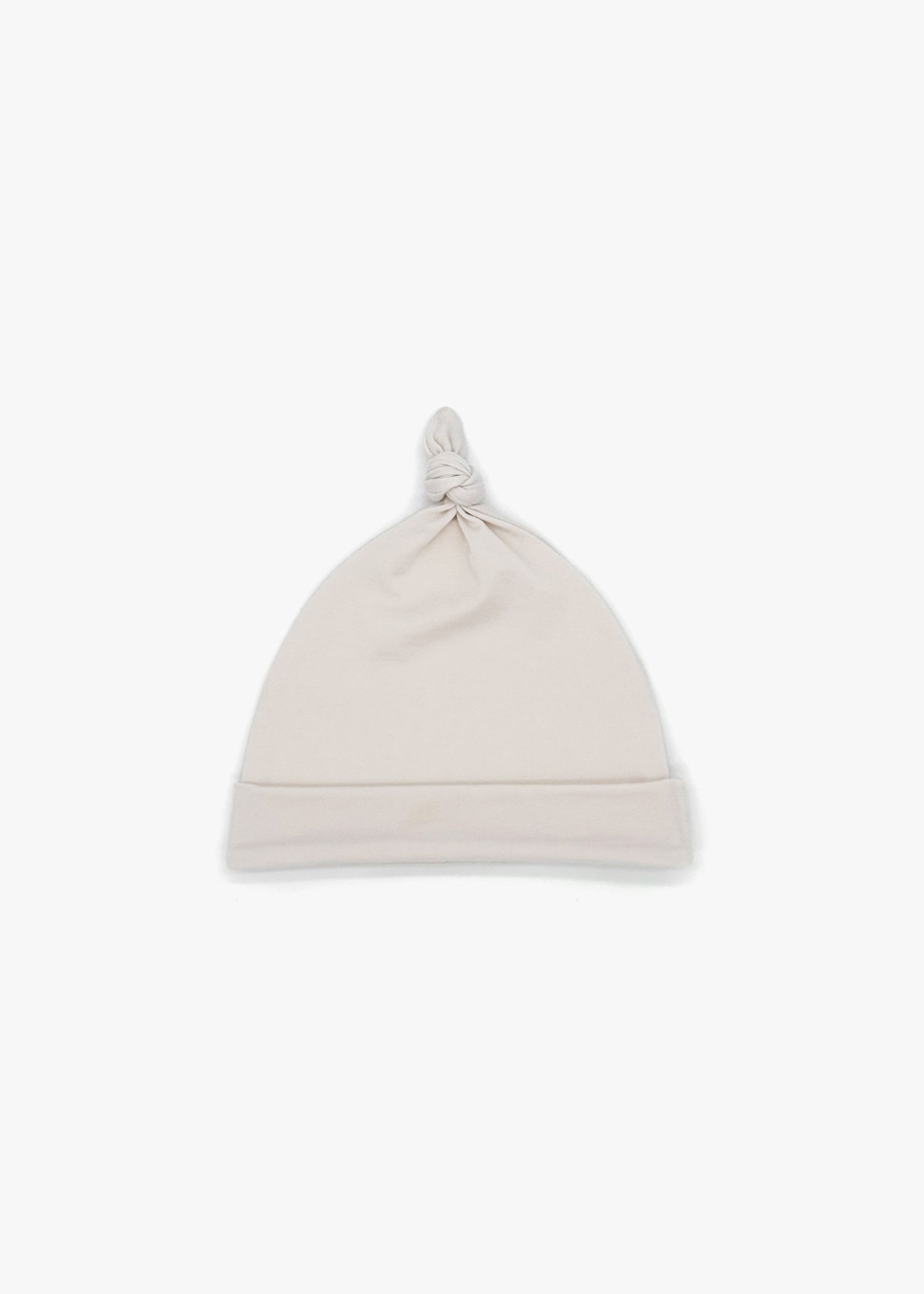 Milana Label Baby Knot Hat in the colour Birch on an off-white background.