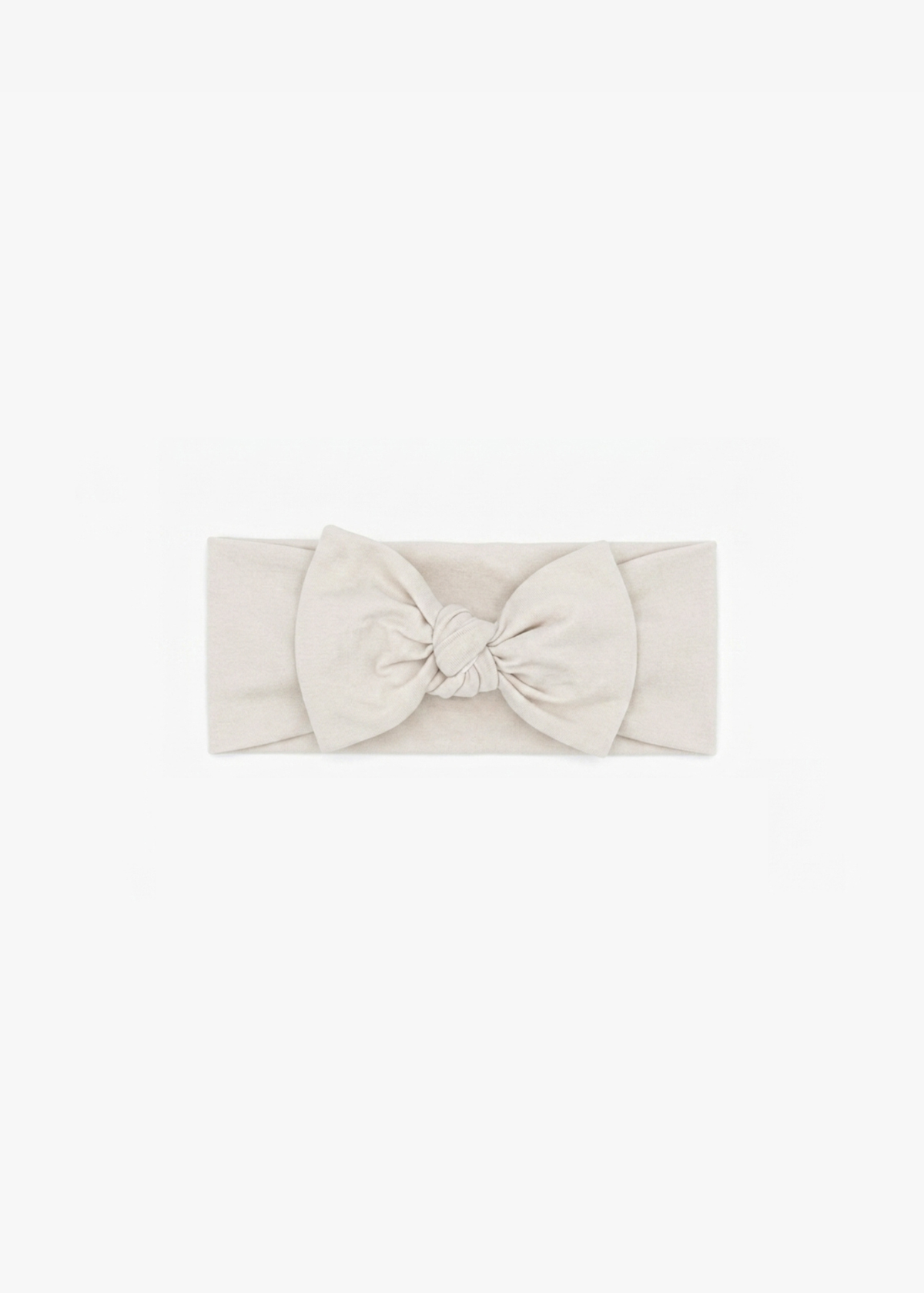 Milana Label Knot Headband in the colour Birch on an off-white background.