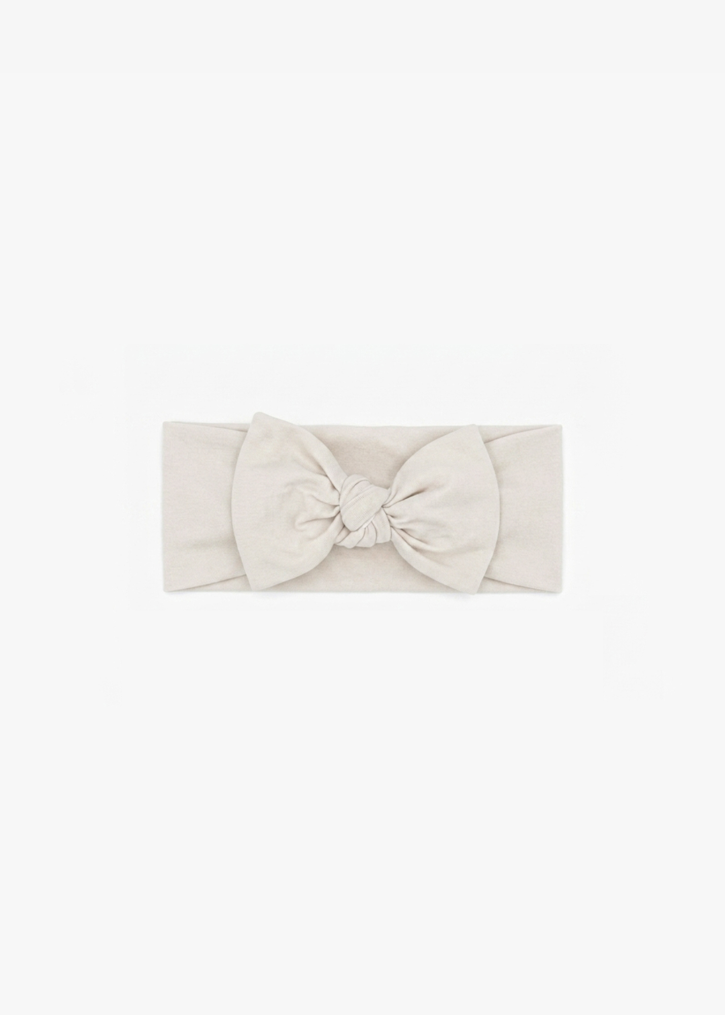 Milana Label Knot Headband in the colour Birch on an off-white background.