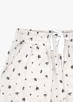 Milana Label Women's Lounge Set in the colour Birch Floral on an off-white background. Highlighting the pockets and waistband.