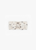 Milana Label Knot Headband in the colour Birch Floral on an off-white background.