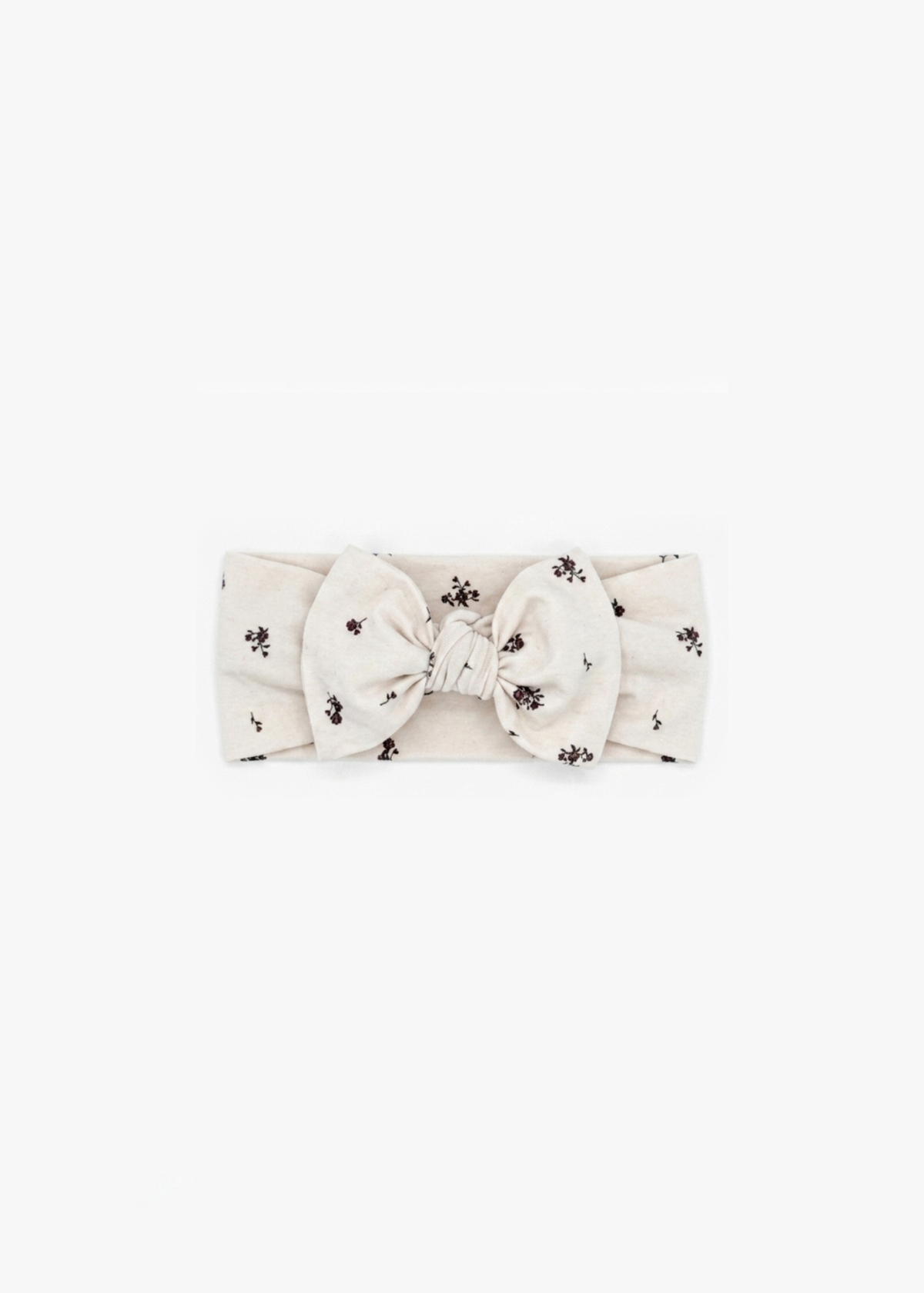 Milana Label Knot Headband in the colour Birch Floral on an off-white background.