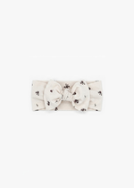 Milana Label Knot Headband in the colour Birch Floral on an off-white background.