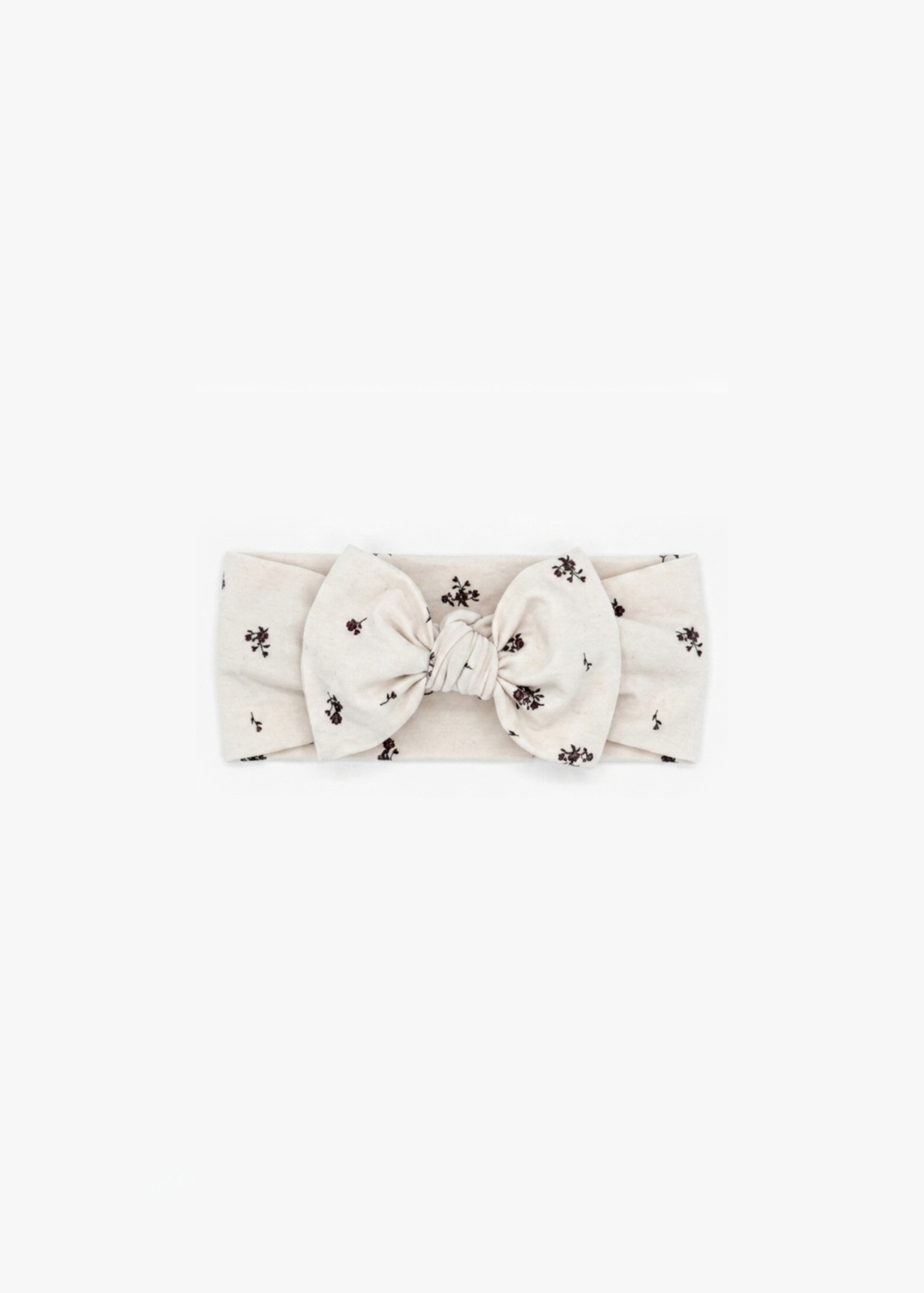 Milana Label Knot Headband in the colour Birch Floral on an off-white background.