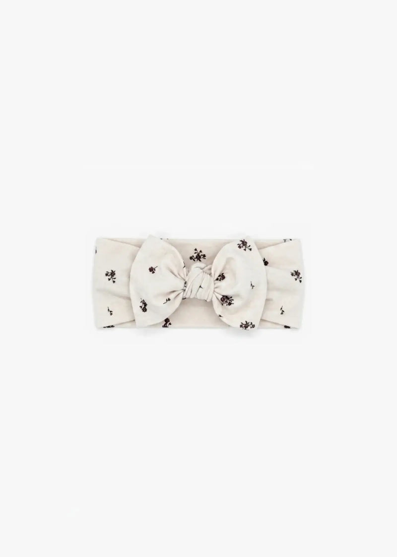 Milana Label Knot Headband in the colour Birch Floral on an off-white background.
