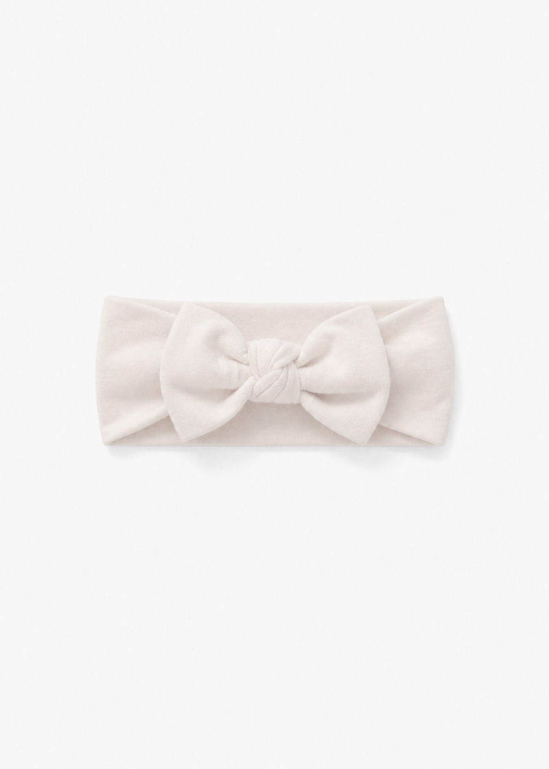 Milana Label baby bow headband in Birch, a warm neutral tone, photographed flat against a white background.