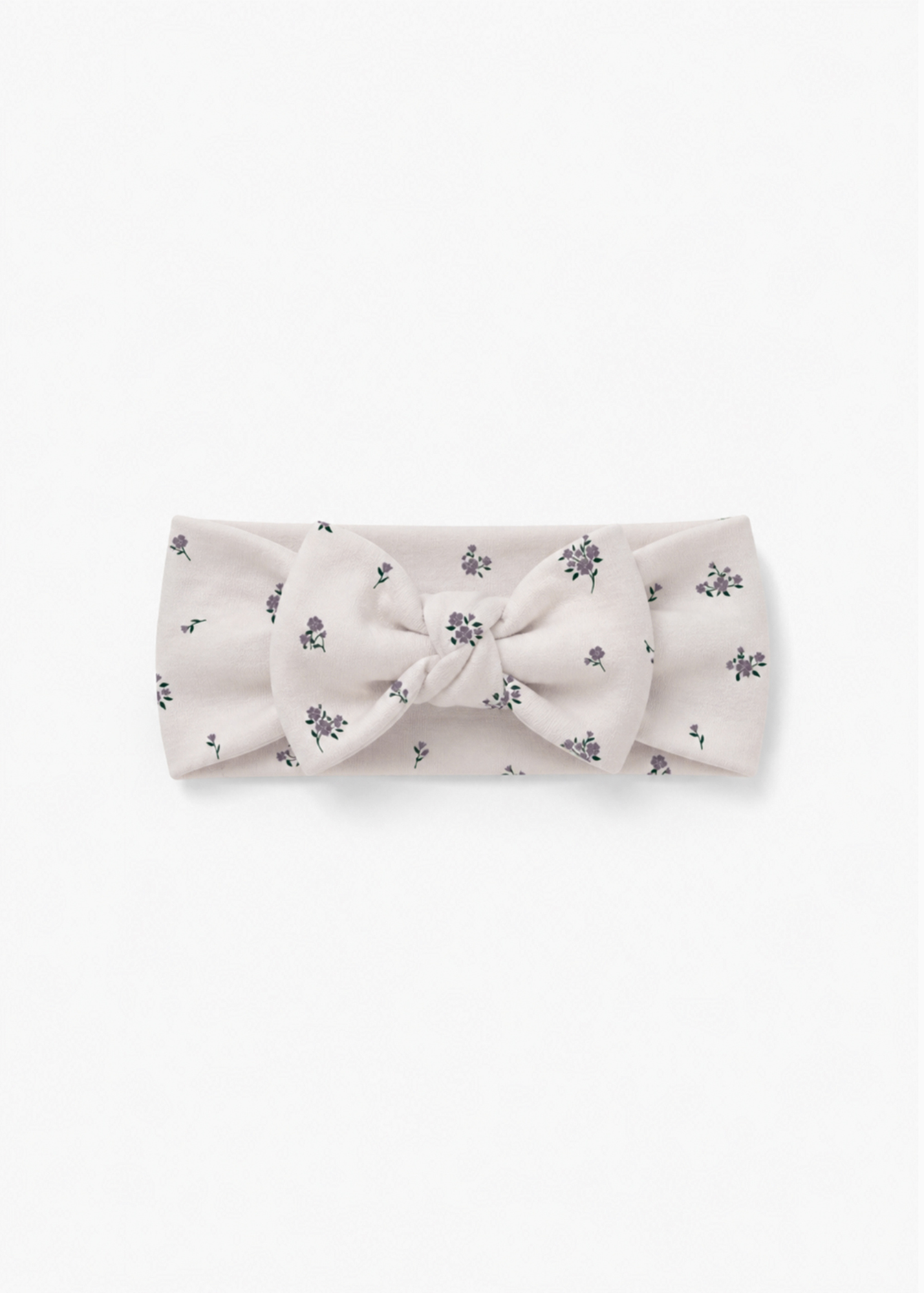 Milana Label baby bow headband in Birch Floral, warm neutral fabric with a scattered purple floral print, photographed flat against a white background.