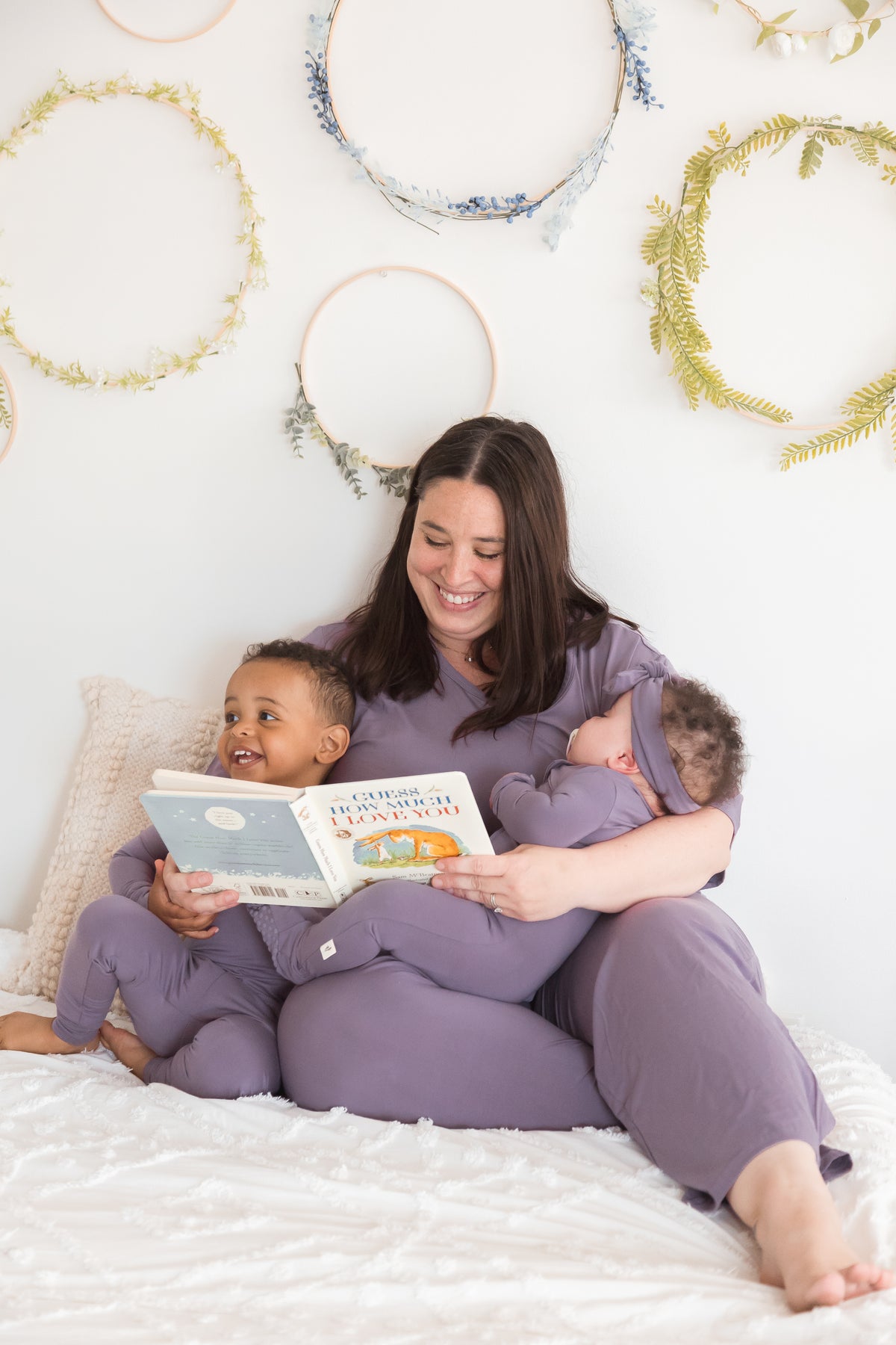 A mom and her kids wearing their matching Milana PJ's in the colour Wild Mulberry.