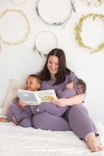 A mom and her kids wearing their matching Milana PJ's in the colour Wild Mulberry.