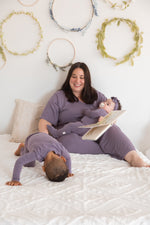 A mom and her kids wearing their matching Milana PJ's in the colour Wild Mulberry.