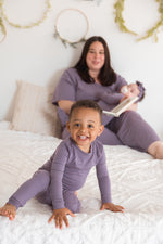 A mom and her kids wearing their matching Milana PJ's in the colour Wild Mulberry.