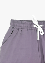 Milana Label Women's Lounge Set in the colour Wild Mulberry on an off-white background. Highlighting the pockets and waistband.