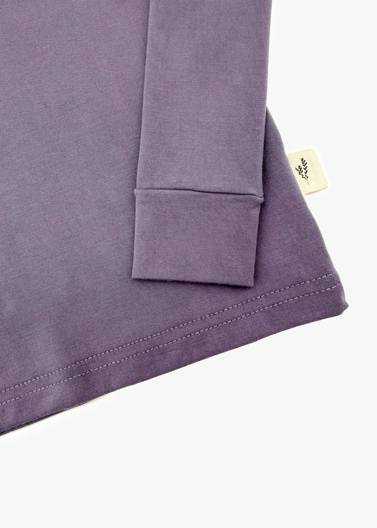 Milana Label Long Sleeve PJ Set  in the colour Wild Mulberry on an off white background. Highlighting the cuff and hem.