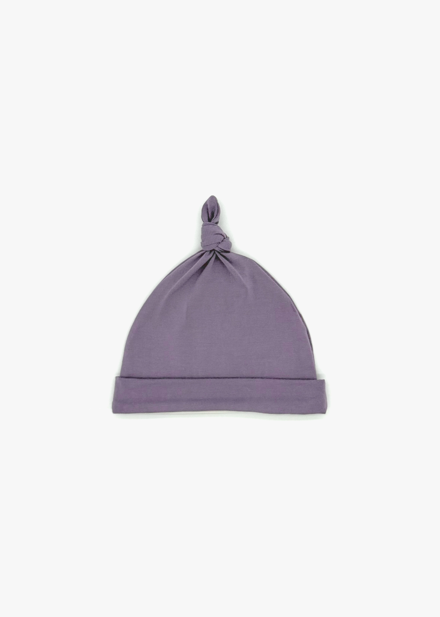 Milana Label Baby Knot Hat in the colour Wild Mulberry on an off-white background.