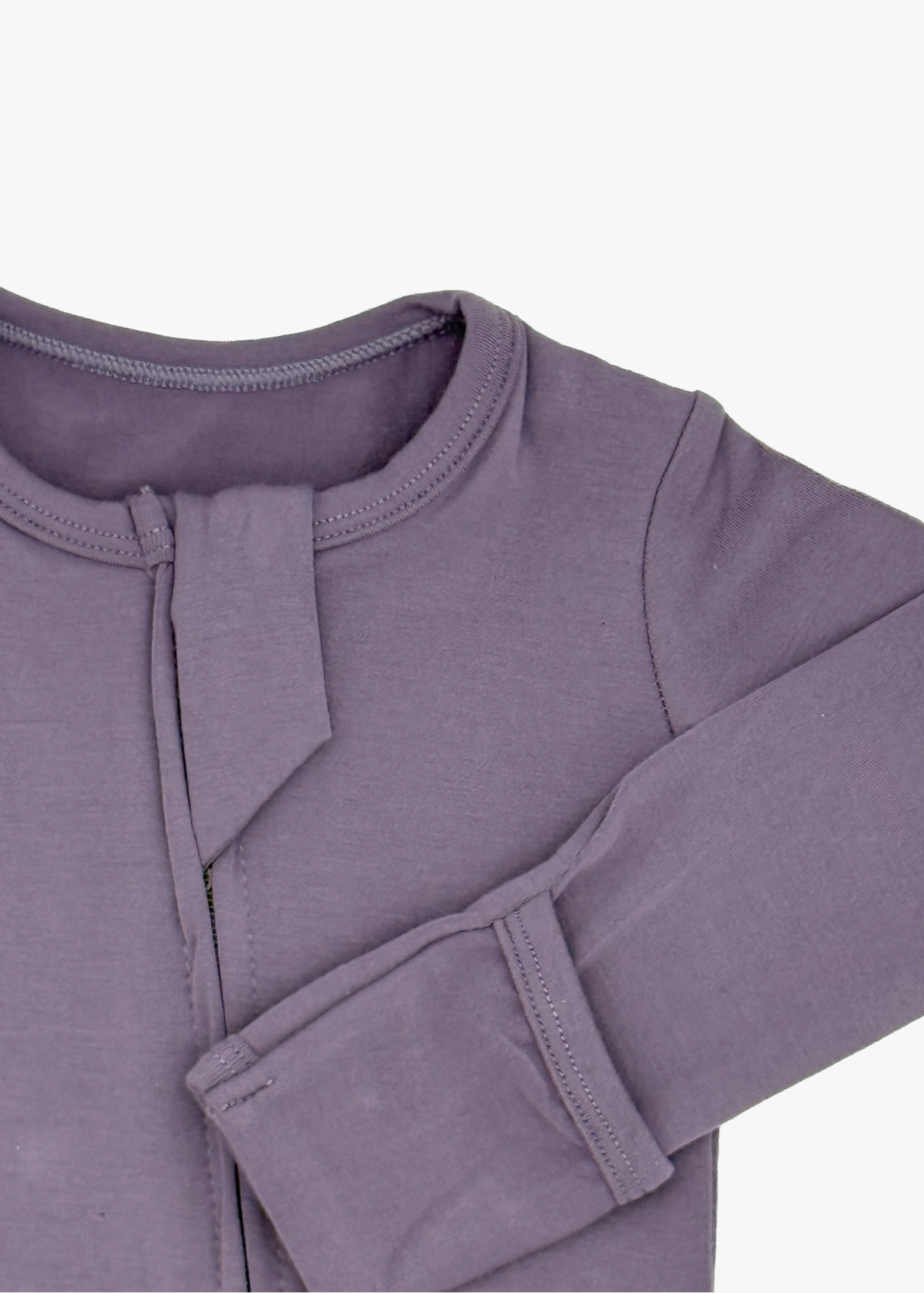 Milana Label Zippered Sleeper in the colour Wild Mulberry on an off white background. Highlighting the fold-over mitts.