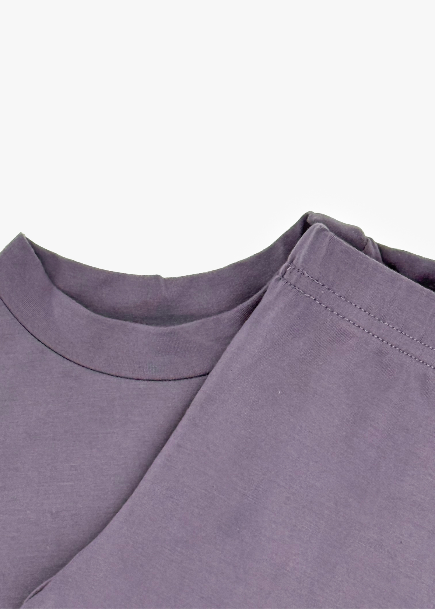 Milana Label Long Sleeve PJ Set  in the colour Wild Mulberry on an off white background. Highlighting the neckline and elastic waistband.