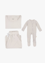 Milana Label mommy and me sleeper bundle in Birch, adult two-piece lounge set and baby zip footie sleeper laid flat together.