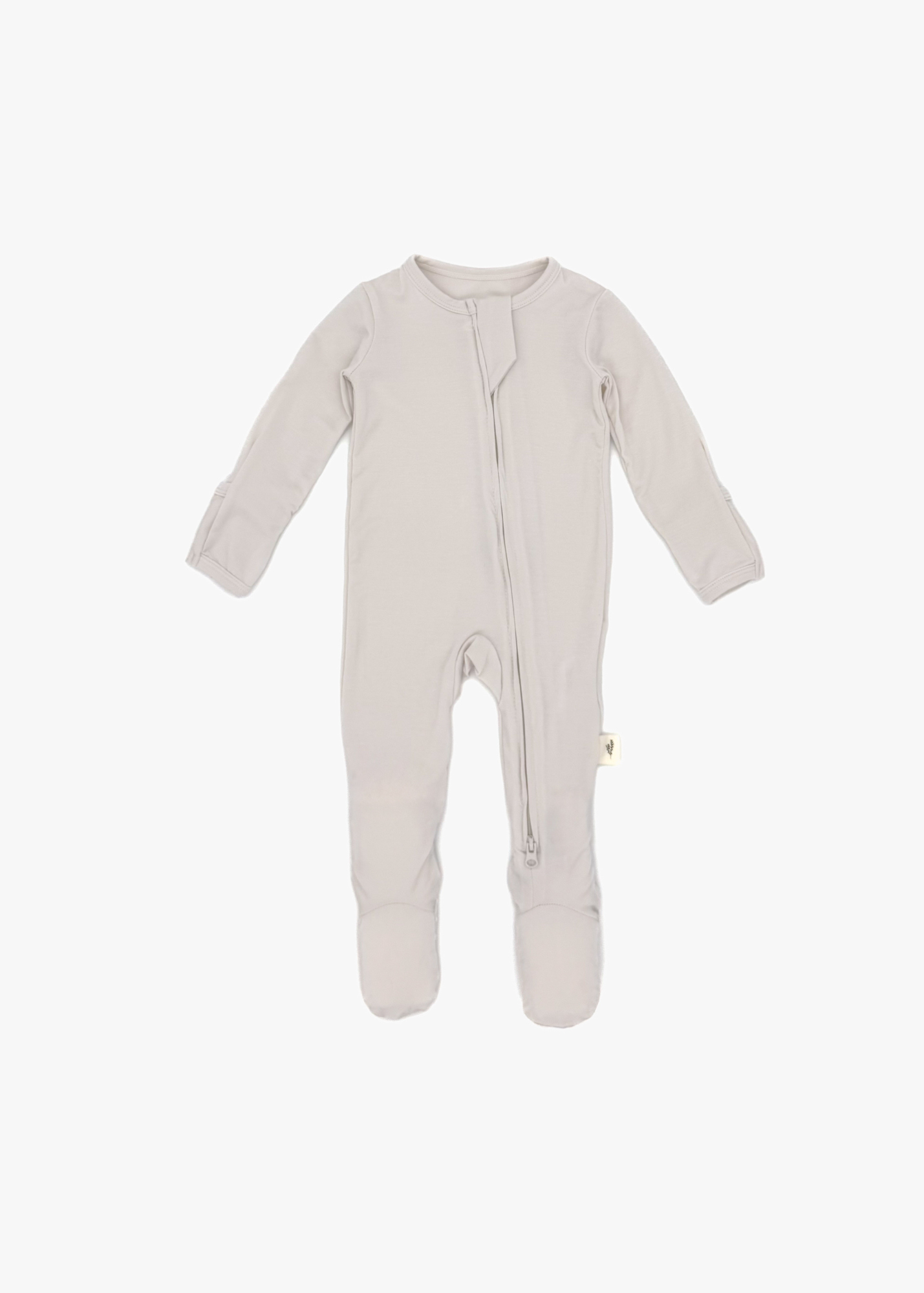 Milana Label Zippered Sleeper in the colour Birch on an off white background.