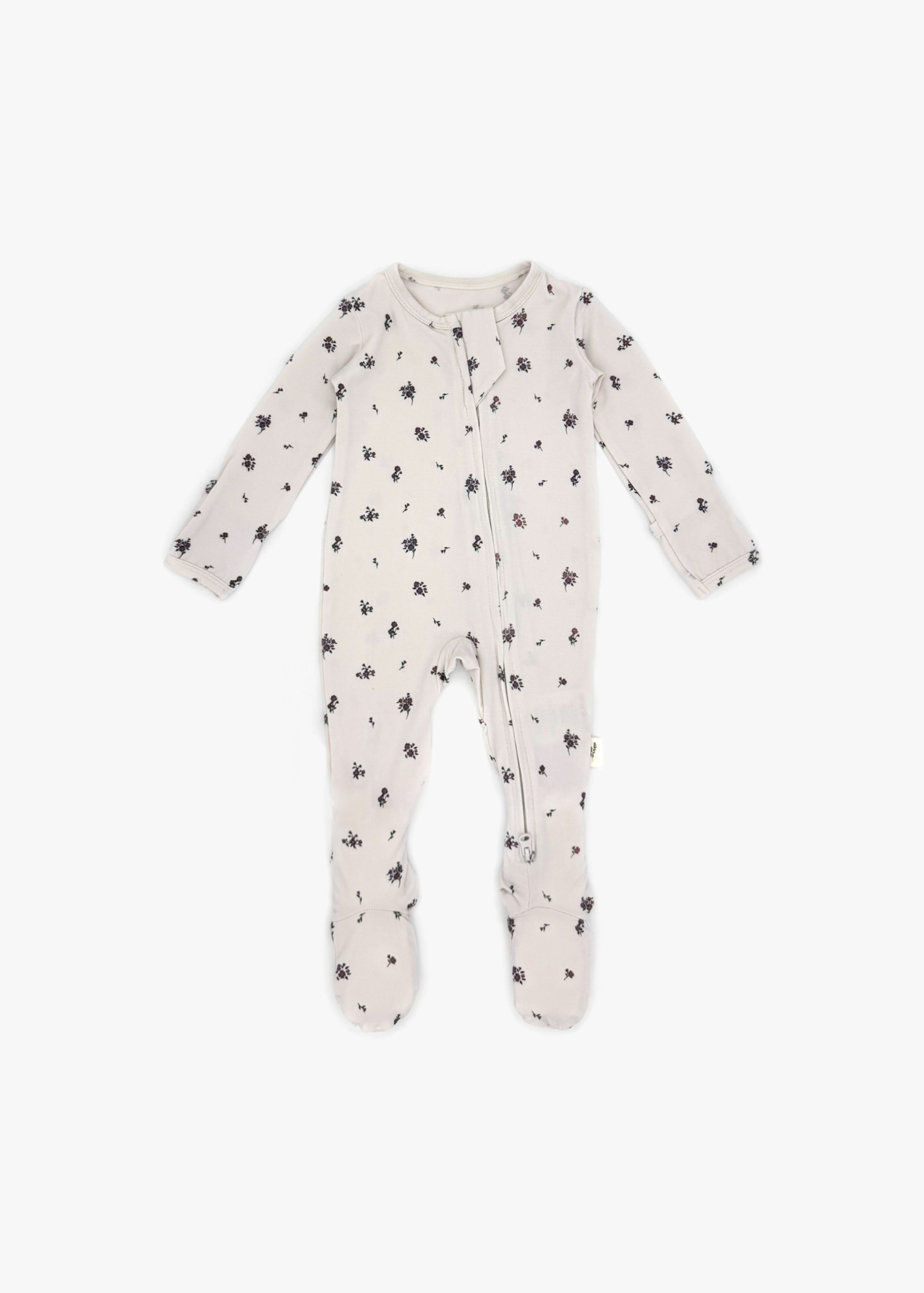 Milana Label Zippered Sleeper in the colour Birch Floral  on an off white background.