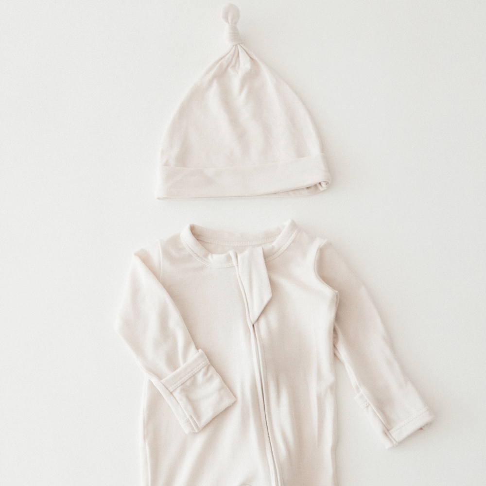 A neutral baby outfit from Milana Label.