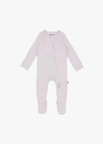 A flat lay of a ribbed zippered sleeper in the colour Petal by Milana Label.