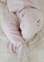 A close up of the feet on the Milana Label ribbed zippered sleeper.