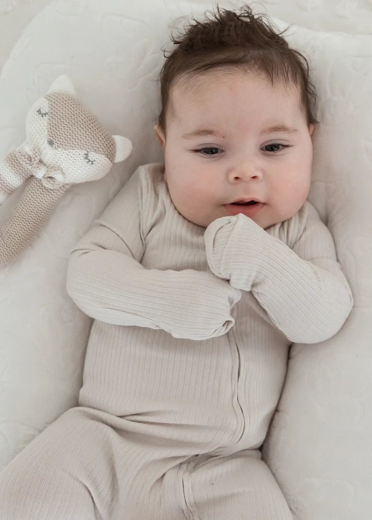 A close-up of the fold-over mitts on the Stone footie PJ available on all sizes.