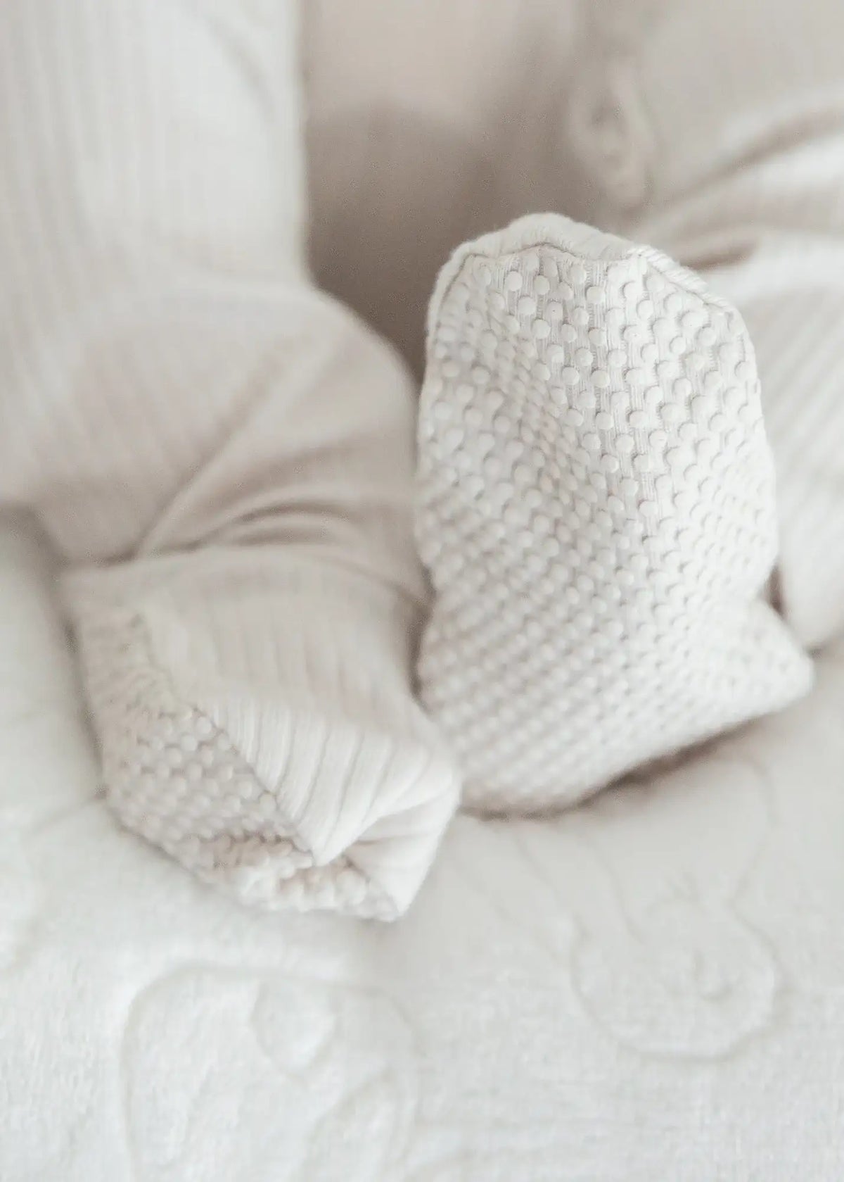 A close-up of the foot grips on the Stone sleeper, available on sizes 6/12 months and up.
