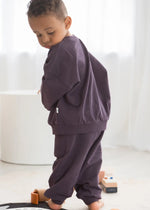A close-up of the organic cotton fabric used in the Milana Label jogger set in Elderberry purple.