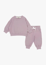 A flat lay of an organic cotton jogger set in the colour Pale Orchid by Milana Label.
