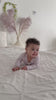 Video showcasing behind the scenes footage from our GOTS certified ribbed organic cotton baby footie photoshoot.