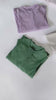 Video showing all 5 colours of the Milana Label ribbed sleeper folded and laid out on an off-white background.